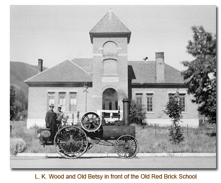 Old Betsy in front of the old Red Brick Mendon School.